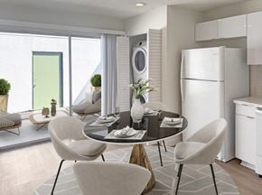 Buena Park apartment for rent - A modern dining room with a round table and chairs.