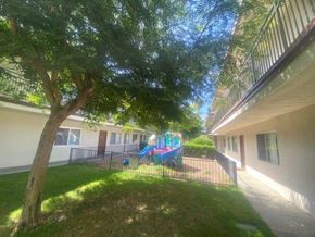 Stanton apartment for rent - a playground in a yard next to a building