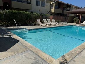 Chatsworth apartment for rent - Villa Del Sol swimming pool with white lounge chairs.