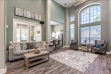 Loveland apartment for rent - A living room with a grey couch and a coffee table.
