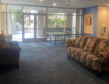 Los Angeles apartment for rent - an empty living room with couches and a table