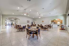 Las Vegas apartment for rent - A spacious dining room with a large table and chairs.