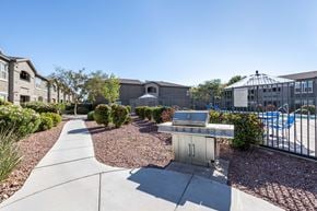 Las Vegas apartment for rent - A sunny day at a residential area with a pool and a BBQ grill.
