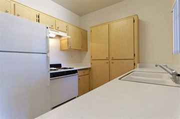 Simi Valley apartment for rent - a kitchen with a sink and a refrigerator