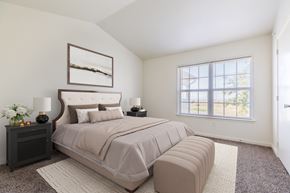 Brighton apartment for rent - A bedroom with a large bed and a window.
