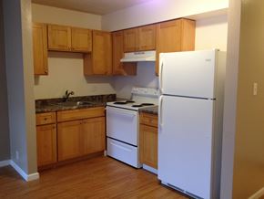 Lahaina apartment for rent - Coconut Inn kitchen area with appliances, cabinets, and counters