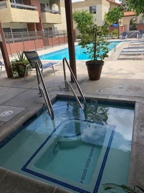 Chatsworth apartment for rent - A small pool with a ladder in the middle of it.