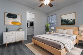 Bedford apartment for rent - a bedroom with a bed and a ceiling fan