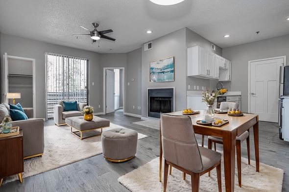 Dallas apartment for rent - an open living room and dining room with a table and chairs