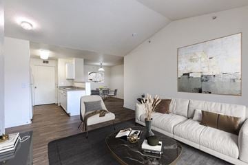 Loveland apartment for rent - A living room with a white couch and a coffee table.