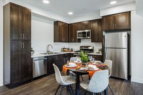 Thousand Oaks apartment for rent - The Harrington dining table and kitchen with appliances