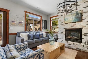 Logan apartment for rent - A living room with a grey couch and a wooden coffee table.
