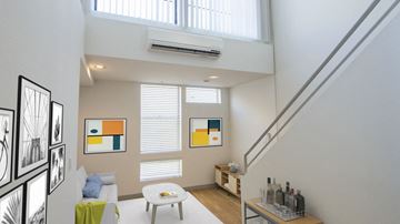 Santa Monica apartment for rent - A living room with a white couch and a painting on the wall.