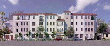 Santa Barbara apartment for rent - A row of multi-story buildings with balconies and trees in front.