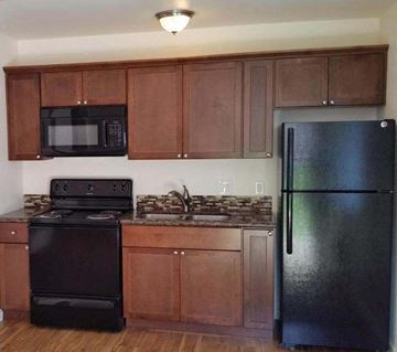 Lemon Grove apartment for rent - a kitchen with a stove and a refrigerator