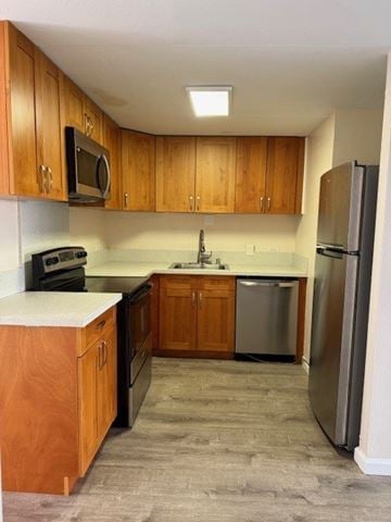 Honolulu apartment for rent - A kitchen with wooden cabinets and a refrigerator.