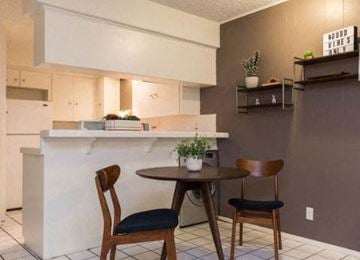Austin apartment for rent - A kitchen with a table and chairs.