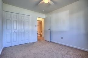 Shippensburg apartment for rent - A room with white doors and carpeted floor.
