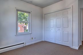 Arendtsville apartment for rent - a bedroom with white walls and a window and two closets