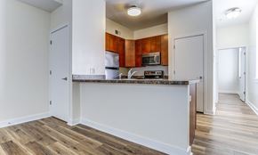 Harrisburg apartment for rent - an empty kitchen with a counter top and a microwave