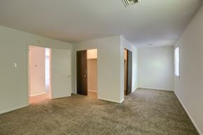 York apartment for rent - an empty living room with white walls and carpet