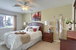 Harrisburg apartment for rent - Harrisburg Apartment | Twin Lakes Apartments | a bedroom with a large bed and a dresser