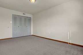 Camp Hill apartment for rent - a bedroom with white walls and carpet and a closet