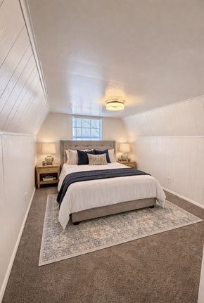 Etters apartment for rent - A bedroom with a bed, two nightstands, and a rug.