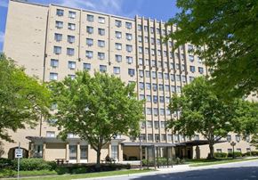 Camp Hill apartment for rent - a large building with trees in front of it