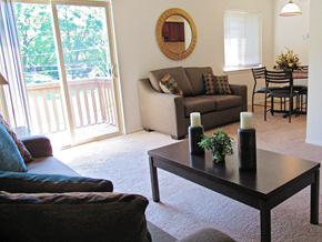 Shippensburg apartment for rent - A living room with a couch, chairs, and a coffee table.