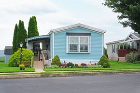 Ephrata apartment for rent - A blue house with a white roof and a small front yard.