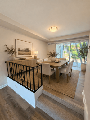 Hershey townhouse for rent - A well-lit dining area with a table set for two and a painting on the wall.