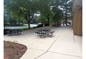 Camp Hill apartment for rent - a sidewalk with tables and benches in a park