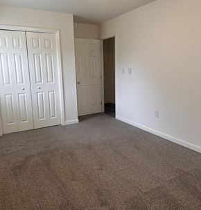 Harrisburg apartment for rent - A room with a carpeted floor and white walls.