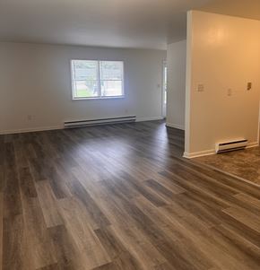 Harrisburg apartment for rent - A room with wooden flooring and a window.