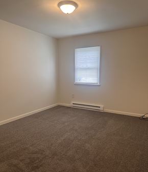 Harrisburg apartment for rent - A room with a window and a radiator on the wall.
