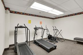 Lancaster apartment for rent - a fitness room with treadmills and weights