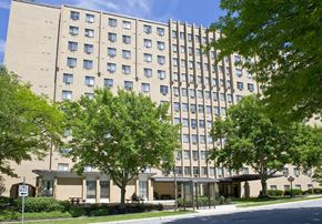 Camp Hill apartment for rent - a large building with trees in front of it