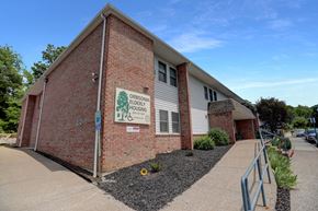 Orbisonia apartment for rent - a brick building with a white sign on it