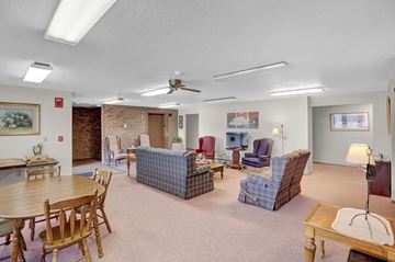 Orbisonia apartment for rent - a living room filled with furniture and a dining table