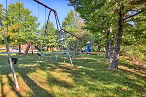 Chambersburg apartment for rent - a swing set in a park with trees