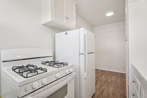 Los Angeles apartment for rent - A white gas stove and refrigerator in a kitchen.