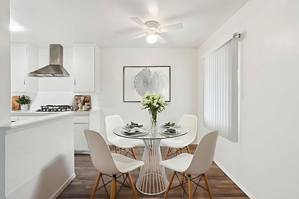 Inglewood apartment for rent - A modern kitchen with a dining table set for four.