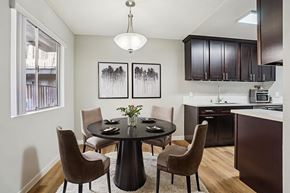 Lake Balboa apartment for rent - A modern dining room with a round table and chairs.