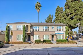 Los Angeles apartment for rent - A building with a blue sign on the front.