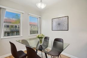 Los Angeles apartment for rent - A dining room with a glass table and chairs.