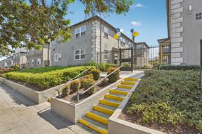 Los Angeles apartment for rent - A set of yellow steps lead up to a building.
