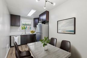 Los Angeles apartment for rent - A modern kitchen with a dining table and chairs.