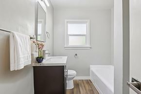 Los Angeles apartment for rent - A white towel hangs on a towel rack in a bathroom.