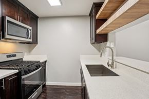 North Hollywood apartment for rent - A modern kitchen with a stainless steel oven and microwave.